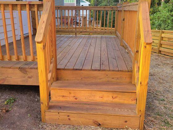 Wood deck with steps down to the yard