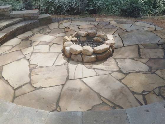 Flagstone fire pit with stone ring