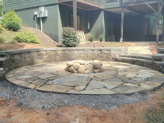 Fire pit with curved seating walls