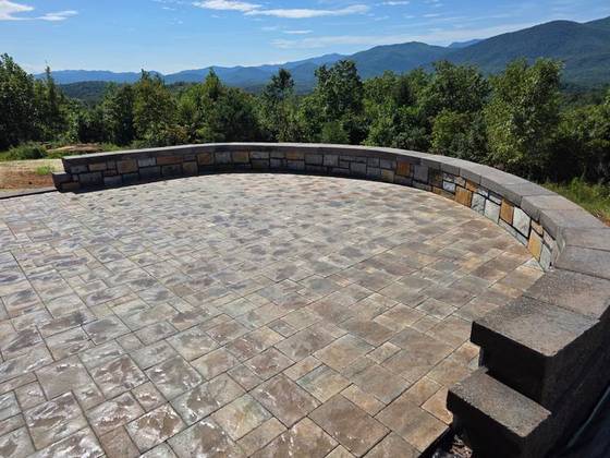 Circular paver patio with seating wall