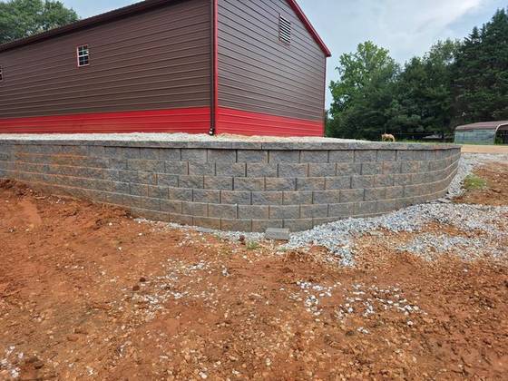 Block wall holding a barn pad