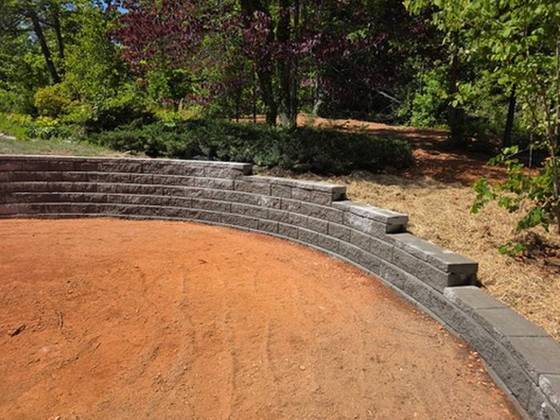 Curved wall with steps set into the face